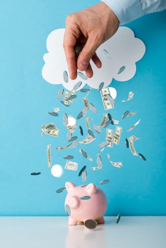 Money pouring into a piggy bank under a cloud, symbolizing saving on cloud licensing expenses.