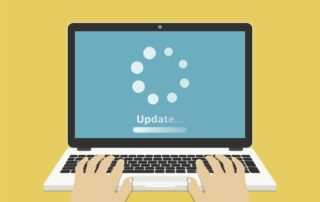 Vector image of person typing on a laptop with "update" on the screen.